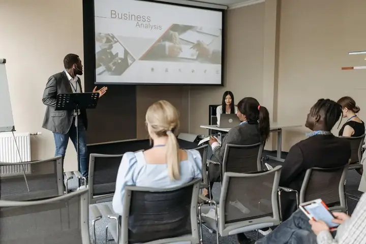 A diverse group participating in an inclusion training seminar
