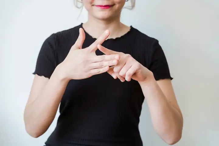 Hands forming a sign in Auslan